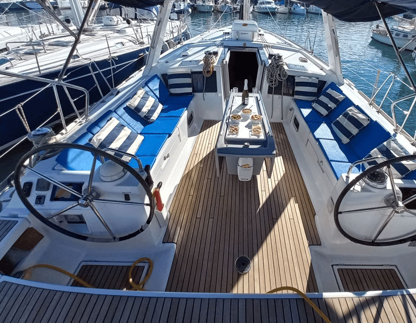 Barcelona: 2-Hour Sailboat Tour with Snacks and Drinks - Raising the sails beside Barceloneta
