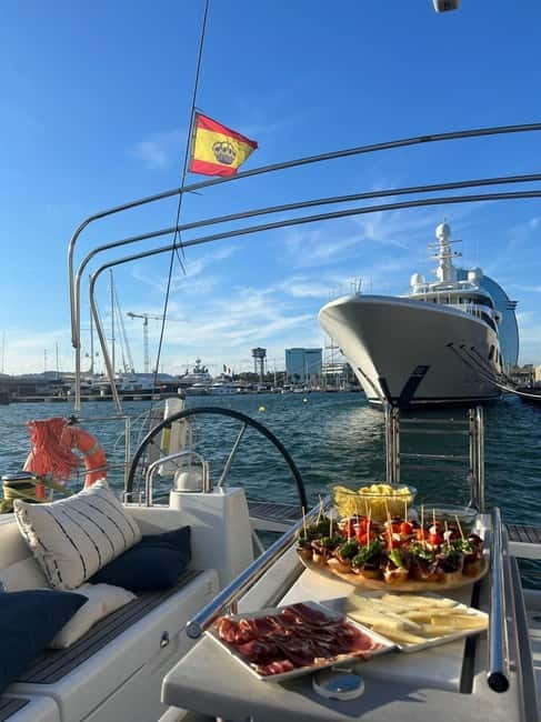 Barcelona: Sailing Tour + Food, Drinks, Swim & Sunset Option - Pinchos, cold cuts, wine, cava, and beer