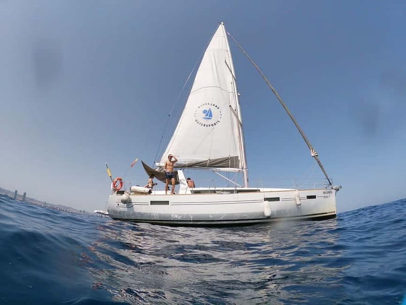 Barcelona: Sailing Tour + Food, Drinks, Swim & Sunset Option - Sunset sailing and the evening mood