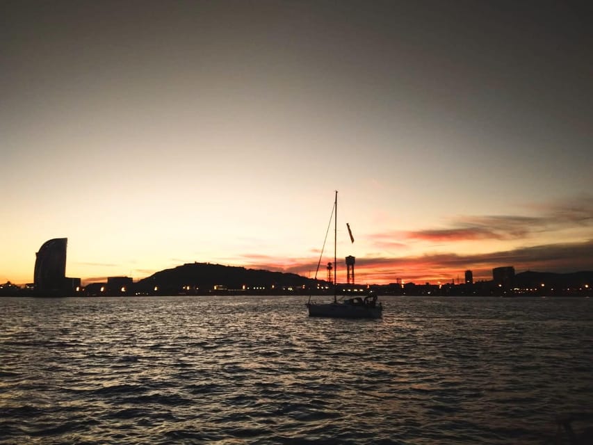 Barcelona: Unique Sunset Sailing Tour with Tapas & Open Bar - What the two-hour trip feels like