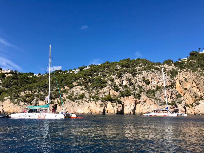Dénia & Jávea: Portixol Sailing Catamaran Excursion with BBQ - The coast, cliffs, and cove stop