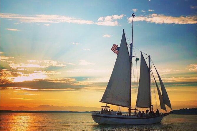 Evening Colors Sunset Sail Tour in Seattle - Raising the sails before sunset