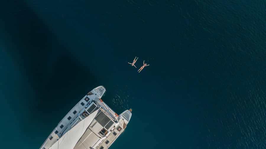 Lake Taupo: Luxury Sailing Catamaran to Māori Rock Carvings - Crossing the clear waters of Lake Taupō