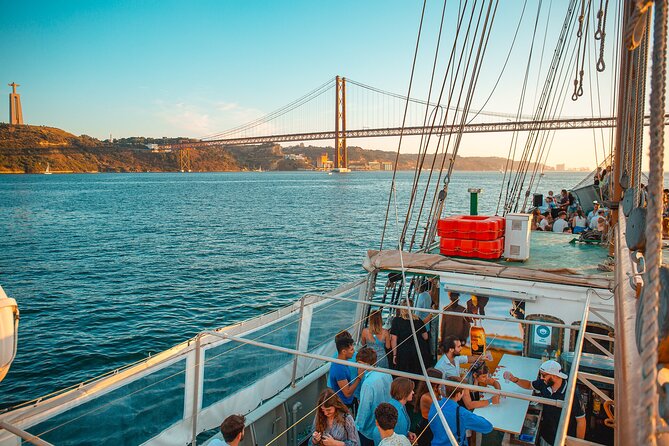 Lisbon Boat Party BIGGEST Sunset Cruise — with Music & Drinks - The DJ, crowd, and nightclub finish