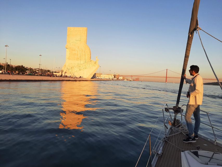 Lisbon: City Skyline Sailboat Cruise with Drink and Snacks - Sailing beneath the 25 de Abril Bridge