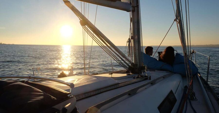 Lisbon: City Skyline Sailboat Cruise with Drink and Snacks - Sunset departures and changing light