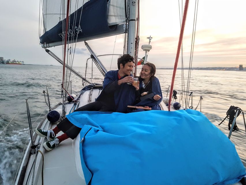 Lisbon: City Skyline Sailboat Cruise with Drink and Snacks - Starting under the 25 de Abril Bridge