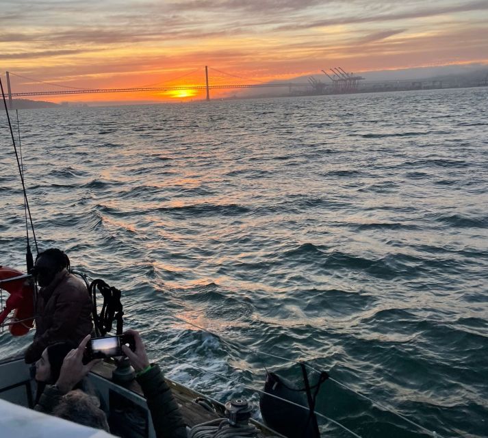 Lisbon: Sailboat Sunset Tour with a Drink - Drinks, snacks, music, and the sunset itself