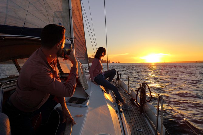 Lisbon Sunset Sailing Tour on Luxury Sailing Yacht with 2 Drinks - Passing beneath the 25th of April Bridge
