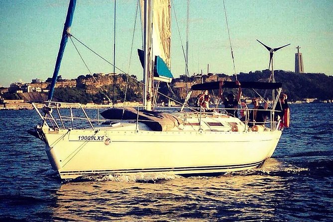 Lisbon Sunset Sailing Tour with White or Rosé Wine and Snacks - Under the 25 de Abril Bridge