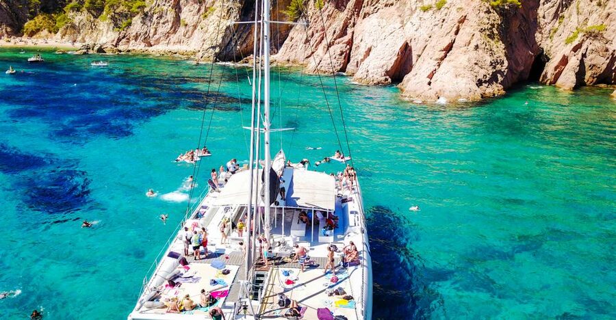 Lloret de Mar: Catamaran Sailing Cruise with BBQ and Drinks - Two hours anchored for swimming and snorkeling
