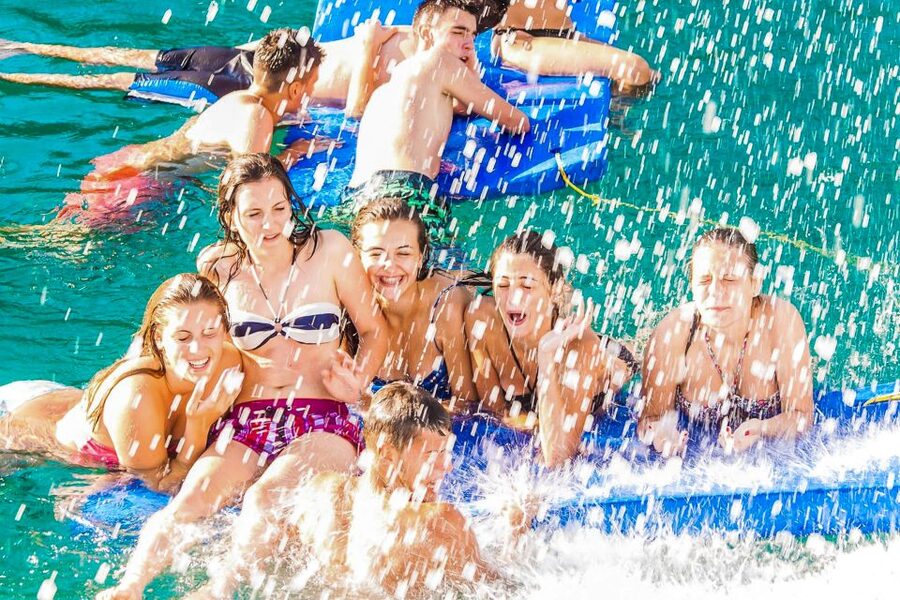 Lloret de Mar: Catamaran Sailing Cruise with BBQ and Drinks - Music, dancing, and the return to Lloret