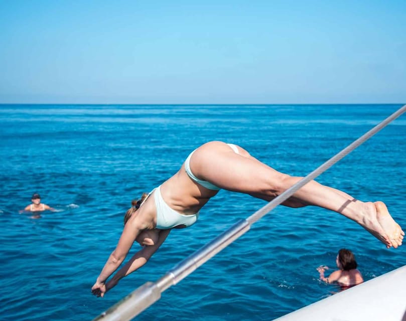 Malaga: Sailing Catamaran with Swimming and Paella Lunch - Open-water swimming away from the beach