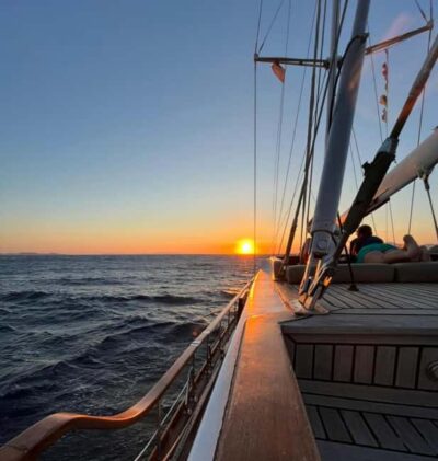 Mykonos: Sunset Sail Cruise to Rhenia, Beach Hopping, Dinner