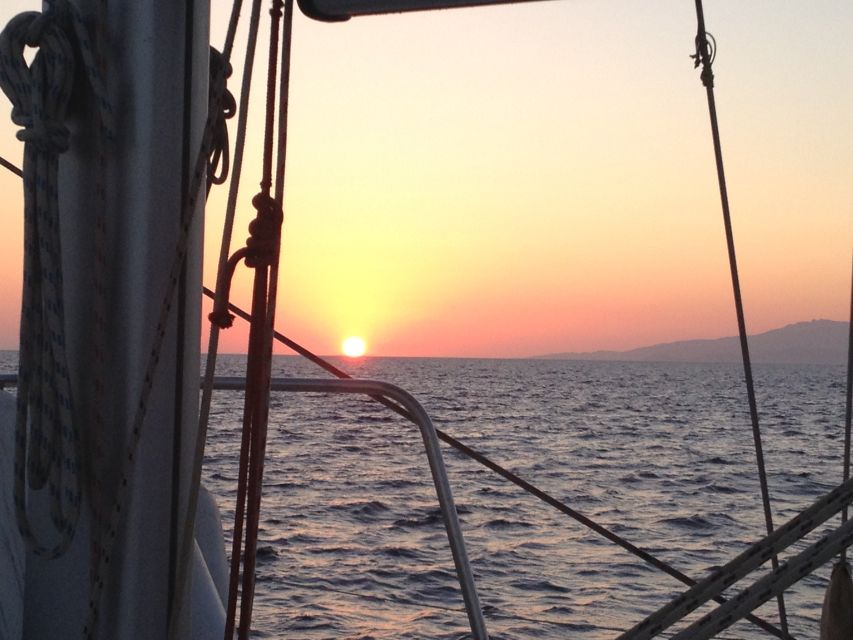 Mykonos: Sunset Sail Cruise to Rhenia, Beach Hopping, Dinner - An early Greek dinner with wine and soft drinks