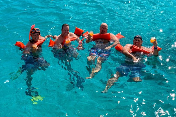 Premium Catamaran Afternoon Sail: Snorkeling and Lunch - Open-bar drinks and a light lunch shape the mood