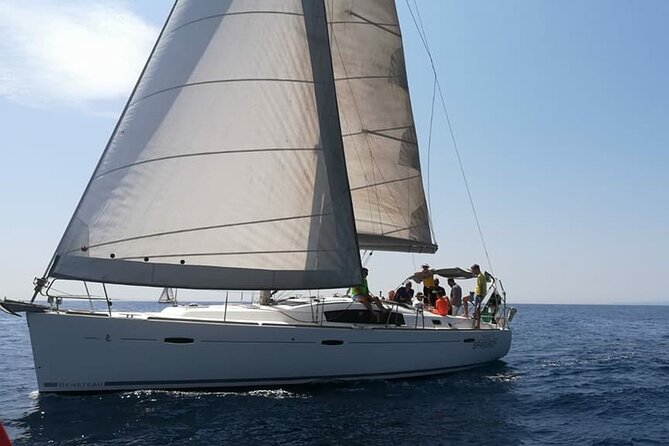 Private Sailing Tour to Cyclops Islands from Catania - Mount Etna rising behind the coast