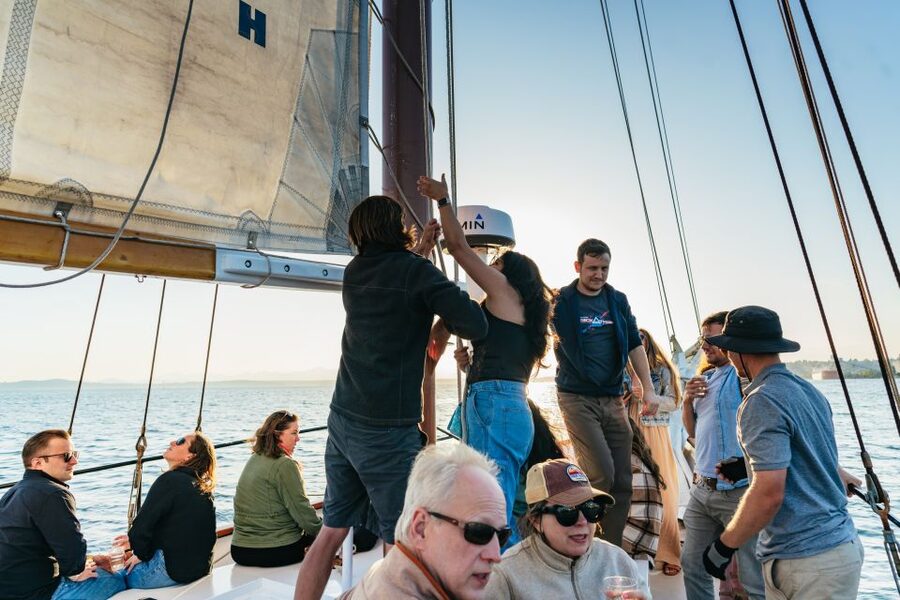 Seattle: Tall Sailboat Sunset Harbor Cruise - A drink while the city changes color