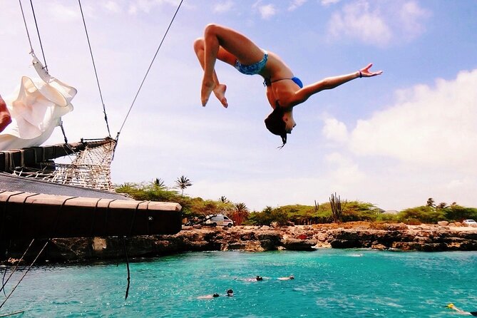 Set Sail in Aruba: Jolly Pirate Cruise with Snorkel Adventure - The rope swing adds a burst of harmless silliness