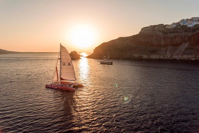 Sunset Sailing Catamaran Cruise in Santorini with BBQ and Drinks - Leaving Ammoudi or Athinios for the caldera